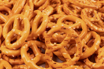 many yellow pretzels near a bunch