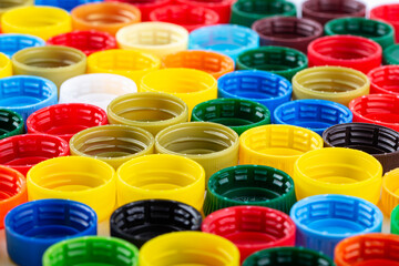 Plastic bottle caps background. Cap material is recyclable.
