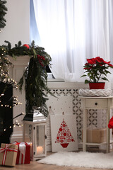 Beautiful pictures of Christmas tree on floor in decorated room. Interior design