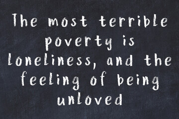 Chalk wise inscription on black chalkboard