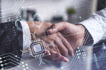 Handshake of two businesspeople as agreement concept to develop a new software to improve service...