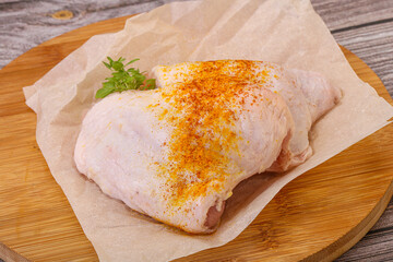 Raw chicken thigh with spices