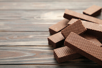 Chocolate wafers on brown background with copy space