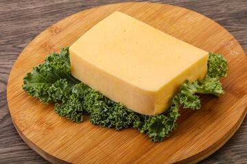 Tasty yelloow Tilsiter cheese brick