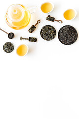 Top view of various tea in iron bowls and spoons. Asian tea ceremony