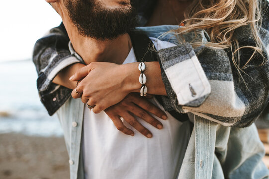 close up of young woman hugging her boyfriend