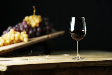 A glass of red wine on the rustic table