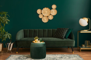 Luxury living room in house with modern interior design, green velvet sofa, coffee table, pouf,...