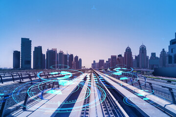 Fototapeta premium The way towards skyscrapers by modern futuristic train. Tech railway delivers commuters to the financial downtown of Dubai. Transportation tech railroad concept. Double exposure