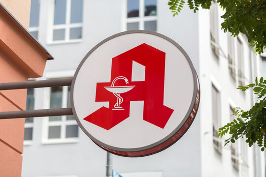 Munich, Bavaria / Germany - Jul 11, 2019: Close up of a pharmacy (german: Apotheke) sign / logo.