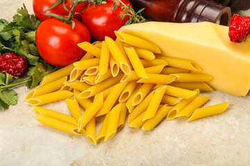 Raw penne rigate for cooking