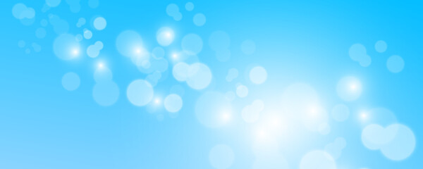 Blurred light sparkle elements. Glitters isolated on blue background.