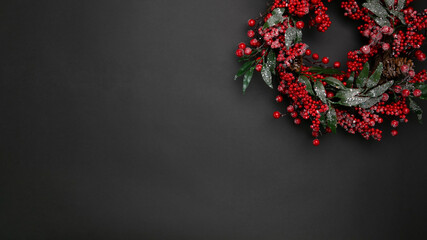 
Christmas wreath on a black background. New Year's composition. template for text