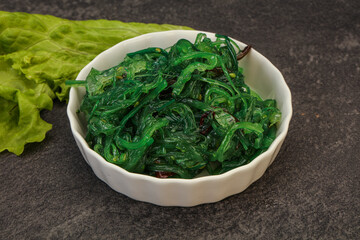 Green Chuka Seaweed Salad Isolated on White Background Top View. Wakame Sea Kelp Salat