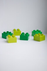 Naklejka premium blocks. Children's constructor.Details are green on a white background.