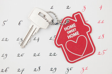 A house key on a calendar background