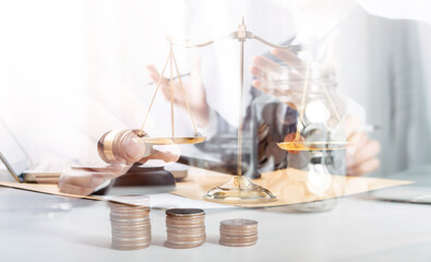 Business and lawyers discussing contract papers with brass scale on desk in office. Law, legal services, advice, justice and law concept picture with film grain effect