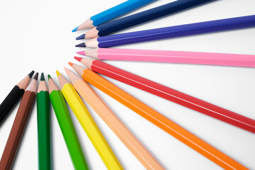 Fototapeta premium Multi-colored pencils on white background, palette of colors