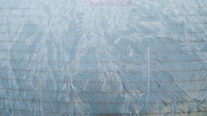 Frosty pattern on the car glass painting by the frost in winter