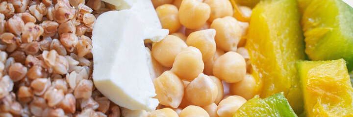 Food bowl with chickpeaks. Health dinner. Vegetarian cooking cuisine. Cafe organic meal. Fresh lunch with pumpkin and feta cheese. Detox spicy. Above view. Flatlay. Closeup. Banner
