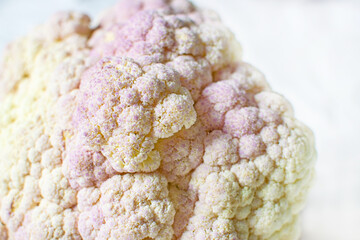 Close-up of the pink cauliflower on the table. Healthy food, and vegetables.