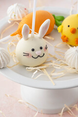 Delicious sweet cake pops on light background, closeup. Easter holiday.