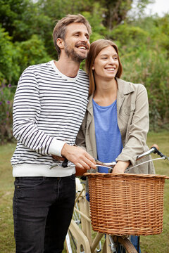 Smiling mid adult couple looking away