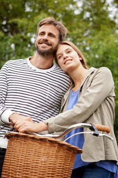 Smiling mid adult couple looking away