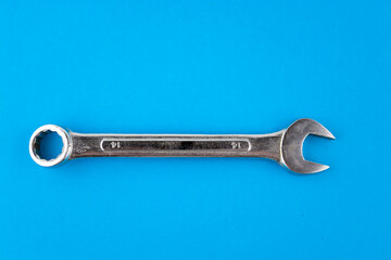 Wrench, spanner isolated blue background