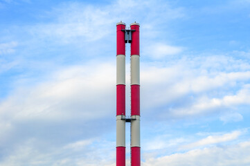 Pipes on the background of blue sky with white clouds