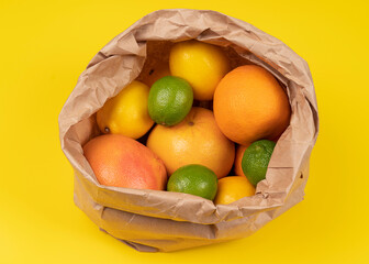 Ripe citrus fruits on a paper bag