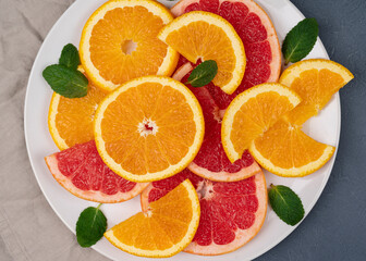 fresh sliced mixed citrus fruits on table. background, concept of healthy eating, dieting, top view 