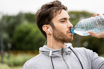 Young man drinking water