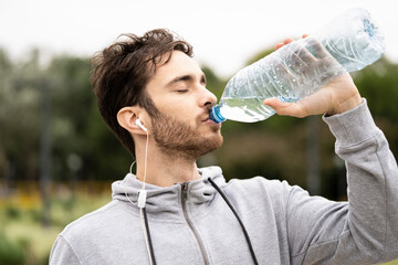 Young man drinking water