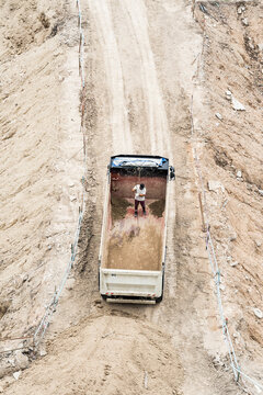 Construction worker working in dumper truck