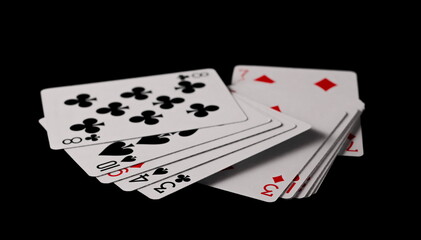 Poker playing cards isolated on black background with clipping path
