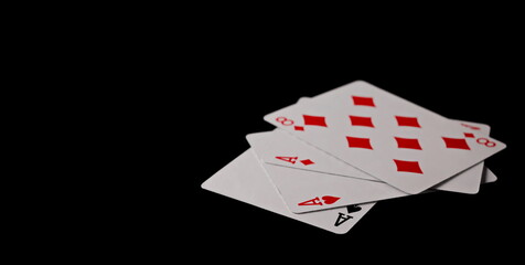 Poker playing cards isolated on black background with clipping path