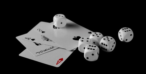 Poker playing cards with dice pile, die set isolated on black background with clipping path