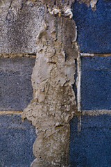 Cement fragments on the bricks