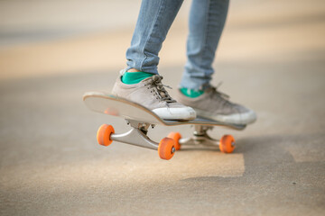 Skateboarder skateboarding outdoors on sunny morning