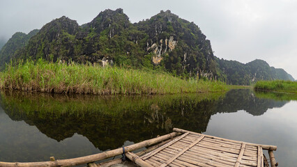 Bamboo rafting on river in Vietnam Ninh binh