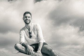 Young man walking in the dunes of Maspalomas in Gran Canaria 