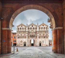 Ferrara, Italy. View of Cathedral through the arch (HDR-image) - obrazy, fototapety, plakaty
