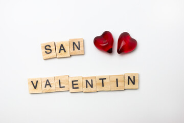 Valentine lettering with red hearts. love