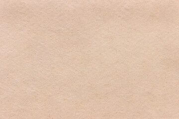 The texture of rough craft paper, interspersed with fibers and particles...