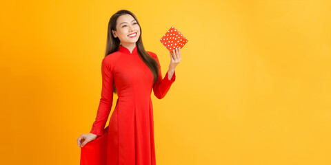 Young beautiful woman with a gift in her hands. Tet Holiday.