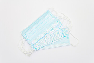 Stack of medical protection masks isolated on white background