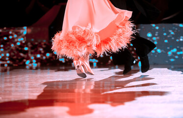 Man and woman dancer latino international dancing.  Ballroom dancing is a team sport. Vintage color filter..