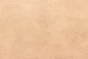 Fototapeta na wymiar Old worn brown cardboard covered with stains.