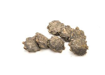 Pile of gac seeds (momordica cochinchinensis) isolated on white background